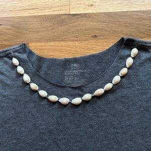 Gray cut tank top with shell embellished neckline